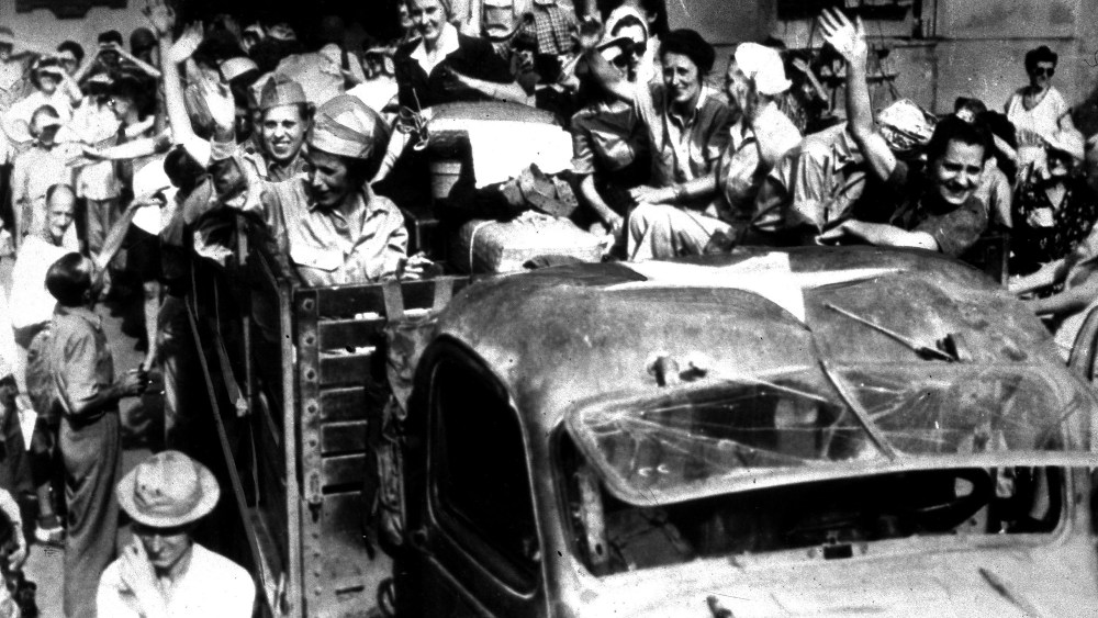 U.S. army nurses, interned since the fall of Corregidor in 1942, wave goodbye to fellow inmates at Santo Tomas, a former Japanese prison camp, in Manila, the Philippines, April 18, 1945. The nurses are returning to their homes and families in the...
