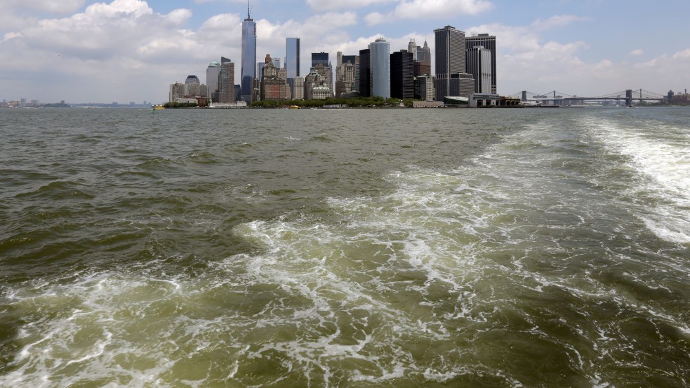 Lower Manhattan is visible from the Staten Island Ferry, in New York's Upper Bay, Tuesday, June 11, 2013. Giant removable floodwalls would be erected around lower Manhattan, and levees, gates and other defenses would be built elsewhere around the city...