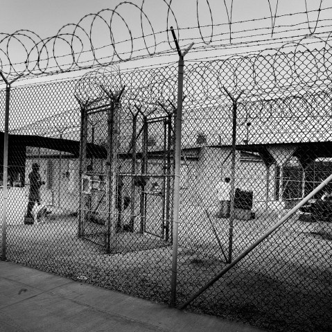 Detainees and guards in camp 4, Guantanamo, June 2006. (Paolo Pellegrin/Magnum)