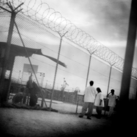 Detainees in camp 4 of Guantanamo Bay in June 2006. (Photo by Paolo Pellegrin/Magnum Photos)
