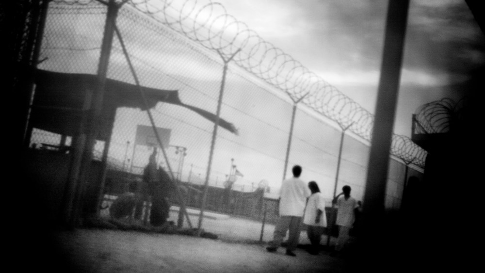 Detainees in camp 4 of Guantanamo Bay in June 2006. (Photo by Paolo Pellegrin/Magnum Photos)