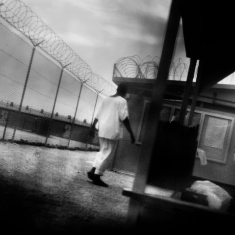 Detainees in are seen camp 4 of Guantanamo Bay in June 2006. (Photo by Paolo Pellegrin/Magnum)
