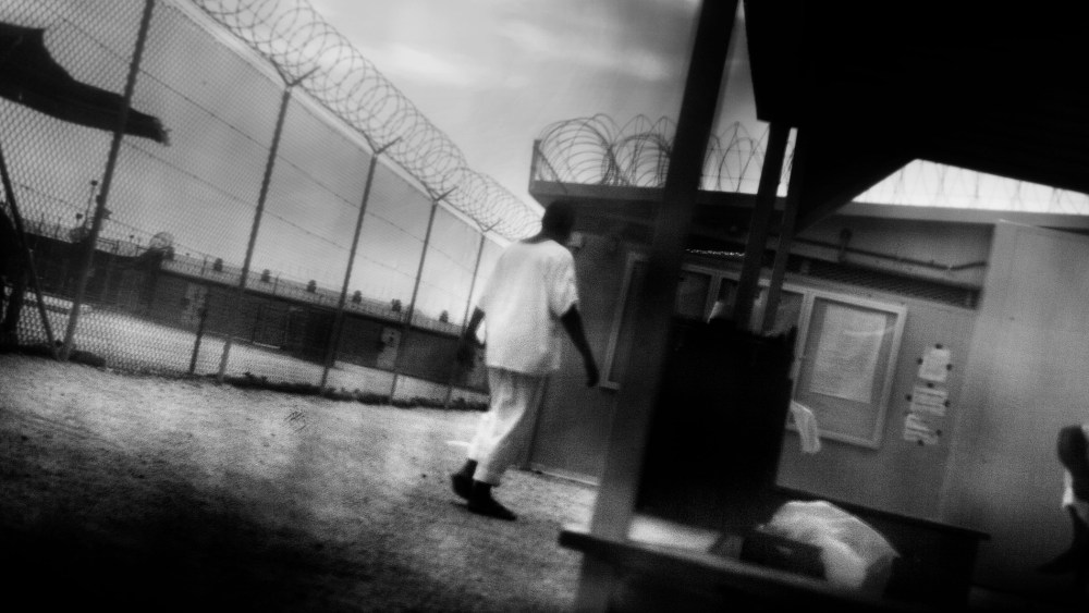 Detainees in are seen camp 4 of Guantanamo Bay in June 2006. (Photo by Paolo Pellegrin/Magnum)