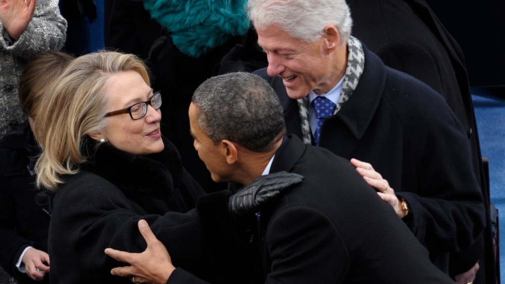 President Barack Obama is greeted by Secretary of State Hillary Clinton and former President Bill Clinton for his ceremonial swearing-in at the U.S. Capitol during the 57th Presidential Inauguration in Washington, Monday, Jan. 21, 2013. (Photo by Susan...