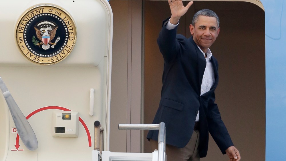 President Barack Obama waves from Air Force One as he leaves Palm Beach International Airport, Monday, Feb. 18, 2013. Obama spent the long Presidents Day weekend playing golf. (AP Photo/Wilfredo Lee)