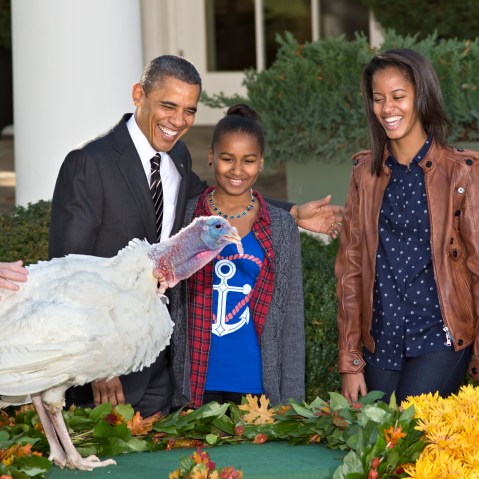 President Barack Obama, with daughters Sasha, center, and Malia, right, carries on the Thanksgiving tradition of saving a turkey from the dinner table with a "presidential pardon," at the White House in Washington, Wednesday, Nov. 21, 2012.  After the...