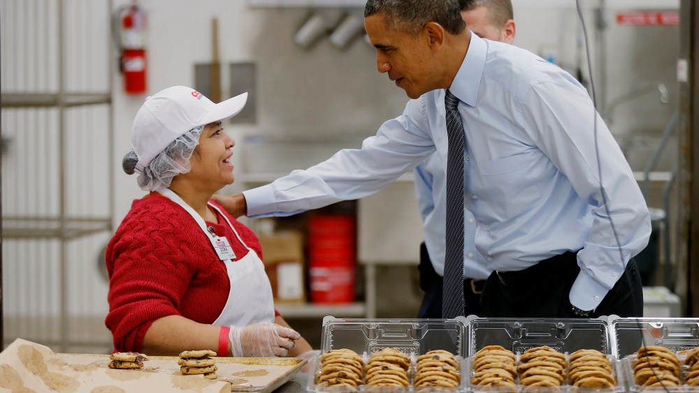 President Barack Obama greets an employee in the bakery at a Costco store in Lanham, Md., Jan. 29, 2014.