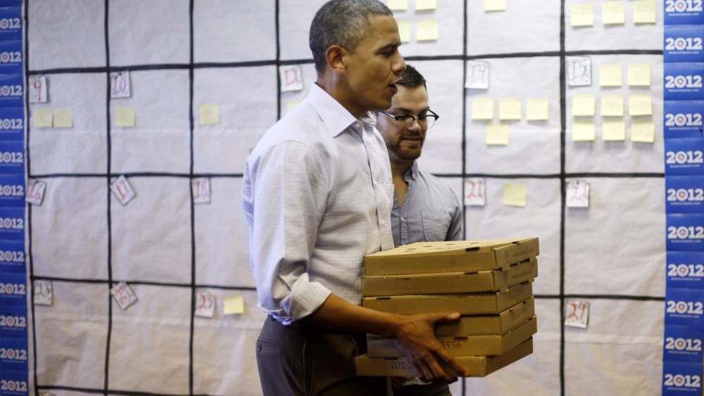 President Barack Obama delivers pizzas for campaign volunteers during a visit to a local campaign office, Monday, Oct. 1, 2012 in Henderson, Nevada.