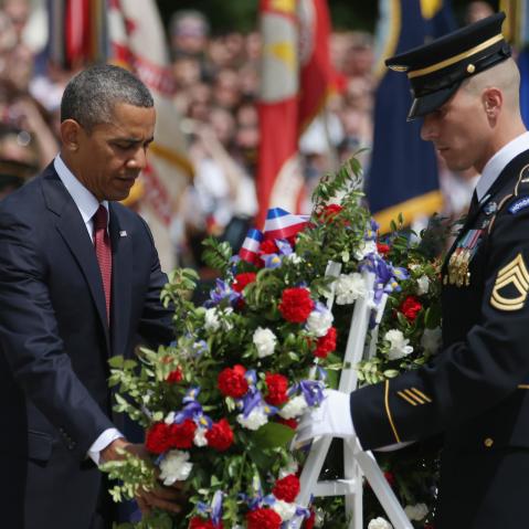 President Barack Obama positions a commemorative wreath during a ceremony on Memorial Day at the Tomb of the Unknowns at Arlington National Cemetery on May 27, 2013 in Arlington, Va. (Photo by Mark Wilson/Getty Images)