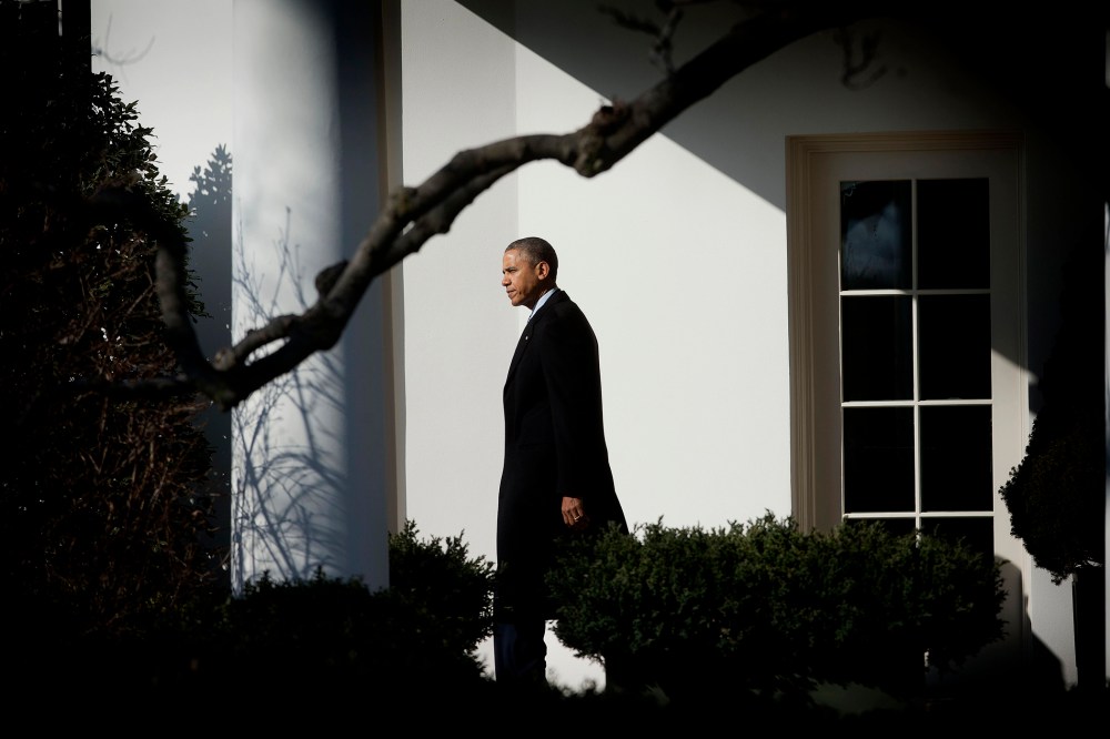 President Barack Obama walks out of the Oval Office of the White House in Washington, Feb. 7, 2014.