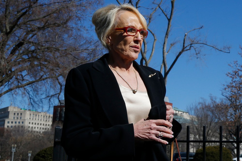 Arizona Gov. Jan Brewer walks towards the West Wing of the White House in Washington, Monday, Feb. 24, 2014.