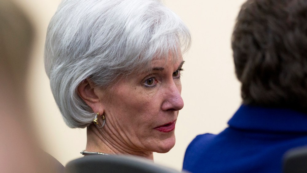 Kathleen Sebelius sits in the audience before President Barack Obama arrives to speak about the ACA in Washington, Dec. 3, 2013.