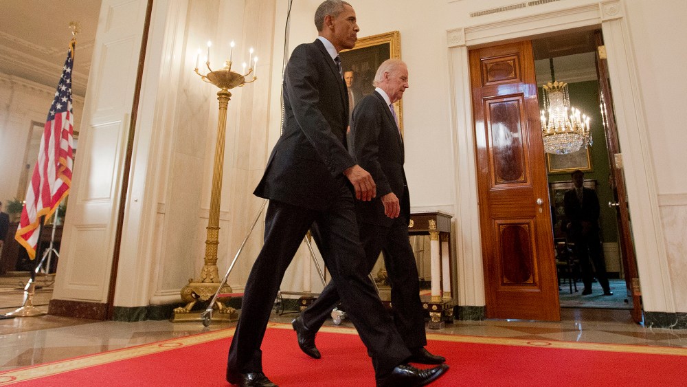 President Barack Obama walks with Vice President Joe Biden, after delivering remarks in the East Room of the White House in Washington, D.C., July 14, 2015, after an Iran nuclear deal is reached. (Photo by Pablo Martinez Monsivais/AP)