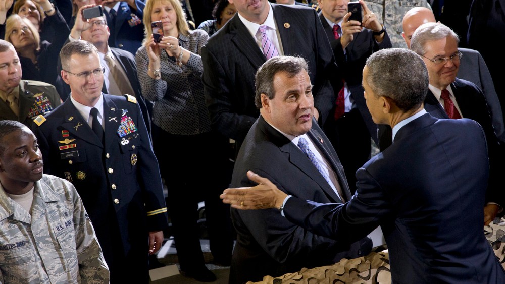 President Barack Obama talks with New Jersey Gov. Chris Christie after speaking to troops at Joint Base McGuire-Dix-Lakehurst, N.J. on Dec. 15, 2014. (Jacquelyn Martin/AP)
