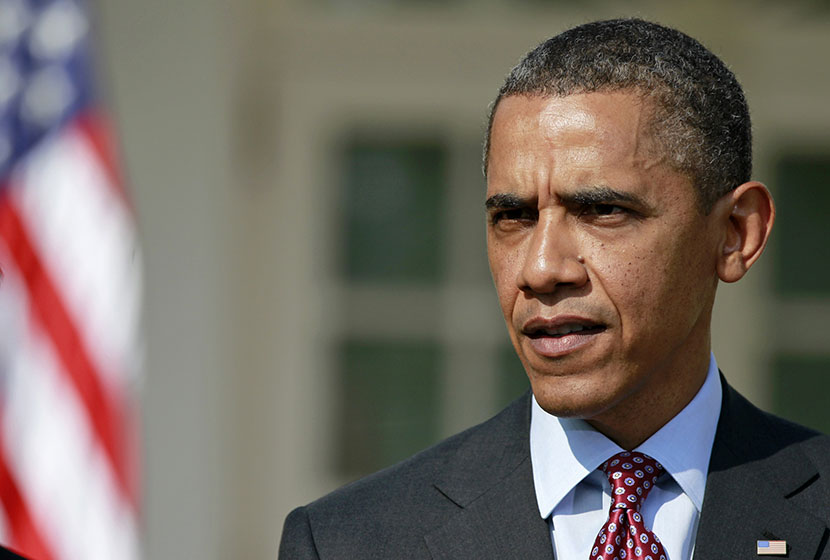 President Barack Obama answers a reporter's question about the death of Trayvon Martin, Friday, March 23, 2012, in the Rose Garden of the White House in Washington. (Photo by Haraz N. Ghanbari/AP)