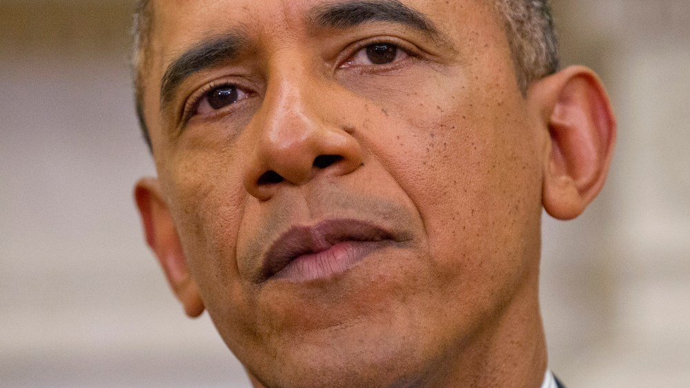 President Barack Obama listens during his meeting in the Oval Office of the White House in Washington, March 12, 2014.