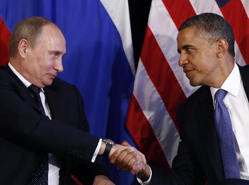 U.S. President Barack Obama (R) shakes hands with Russia's President Vladimir Putin in Los Cabos, Mexico, June 18, 2012. REUTERS/Jason Reed (MEXICO - Tags: POLITICS TPX IMAGES OF THE DAY)