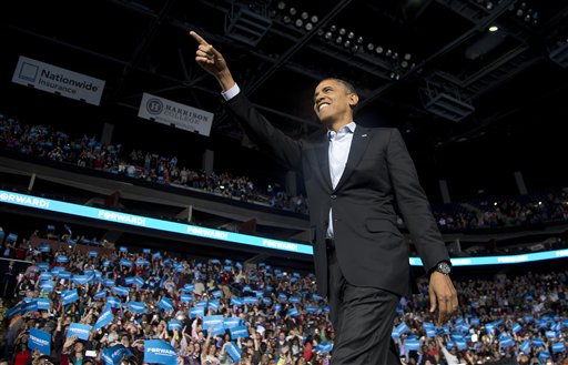 President Barack Obama points to the crowd as he arrives to speak at a campaign event at Nationwide Arena, Monday, Nov. 5, 2012, in Columbus, Ohio. (AP Photo/Carolyn Kaster)
