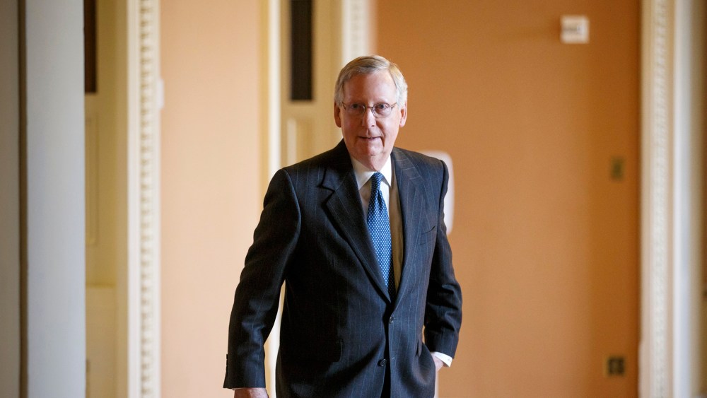 Senate Majority Leader Mitch McConnell of Ky. leaves a weekly Republican policy luncheon on Capitol Hill in Washington on Jan. 13, 2015. (Photo by J. Scott Applewhite/AP)