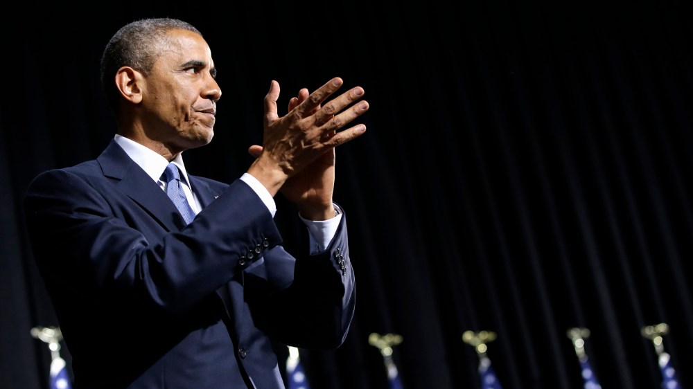 President Barack Obama applauds after signing the Veterans Access to Care through Choice, Accountability, and Transparency Act of 2014, Thursday, Aug. 7, 2014.