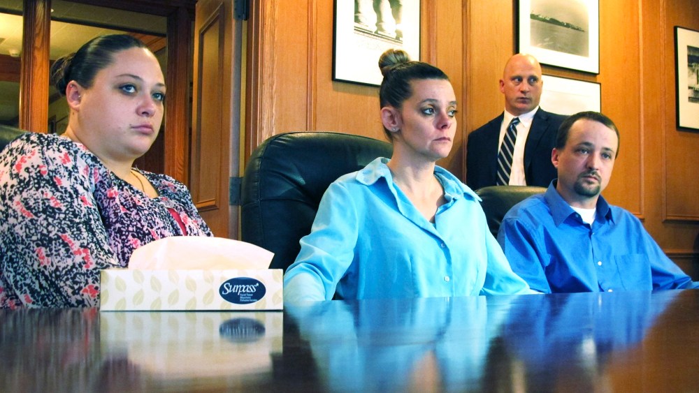Amber, Dennis, and his wife Missie McGuire, announce their planned lawsuit against the state over the unusually slow execution of their father, Dennis McGuire, Jan. 17, 2014.
