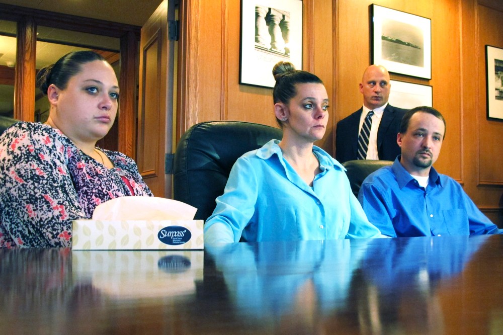 Amber, Dennis, and his wife Missie McGuire, announce their planned lawsuit against the state over the unusually slow execution of their father, Dennis McGuire, Jan. 17, 2014.