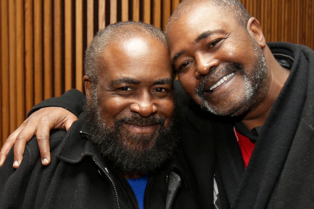 Ronnie Bridgeman, right, now known as Kwame Ajamu, hugs his brother, Wylie Bridgeman, after charges were dismissed on Dec. 9, 2014, in Cleveland, Ohio. (Tony Dejak/AP)