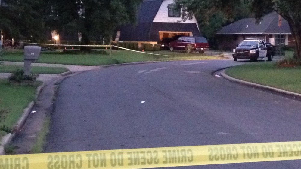 Crime scene tape marks off the area as police investigate scene, July 23, 2015, in Broken Arrow, Okla., where authorities say five people were found dead late Wednesday night. (Photo by Justin Juozapavicius/AP)
