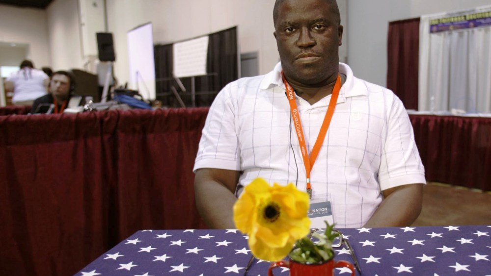 Alvin McEwen, of liberal democrat from Columbia, S.C., discusses politics with Julie Winokur, executive director of Talking Eyes Media, for her new project, Bring it to the Table, at the Netroots Nation 2012 Convention Thursday at the Rhode Island...