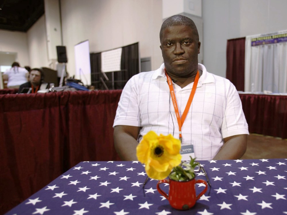 Alvin McEwen, of liberal democrat from Columbia, S.C., discusses politics with Julie Winokur, executive director of Talking Eyes Media, for her new project, Bring it to the Table, at the Netroots Nation 2012 Convention Thursday at the Rhode Island...