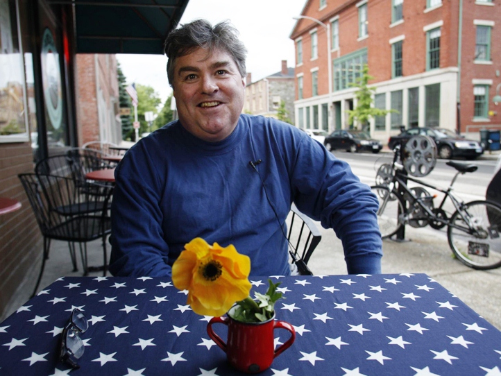 Jonathan Flynn, of Rhode Island, discusses politics with Julie Winokur, executive director of Talking Eyes Media, for her latest project, Bring it to the Table, Wednesday at Cable Car Cinema and Cafe in Providence, Rhode Island, on June 6, 2012.