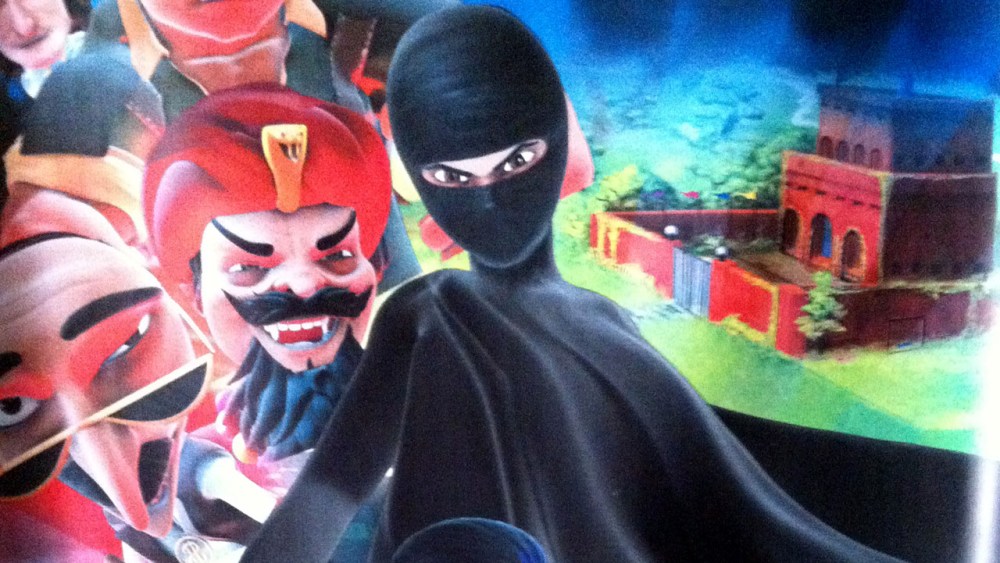 This Thursday, July 11, 2013 photo shows a poster for the "Burka Avenger" cartoon series, which is scheduled to start running on Geo TV in early August. (AP Photo/Sebastian Abbot)