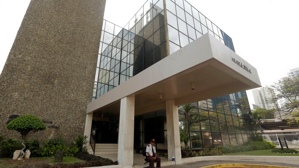 A security guard sit outside the the Mossack Fonseca law firm in Panama City, Sunday, April 3, 2016. (Photo by Arnulfo Franco/AP)