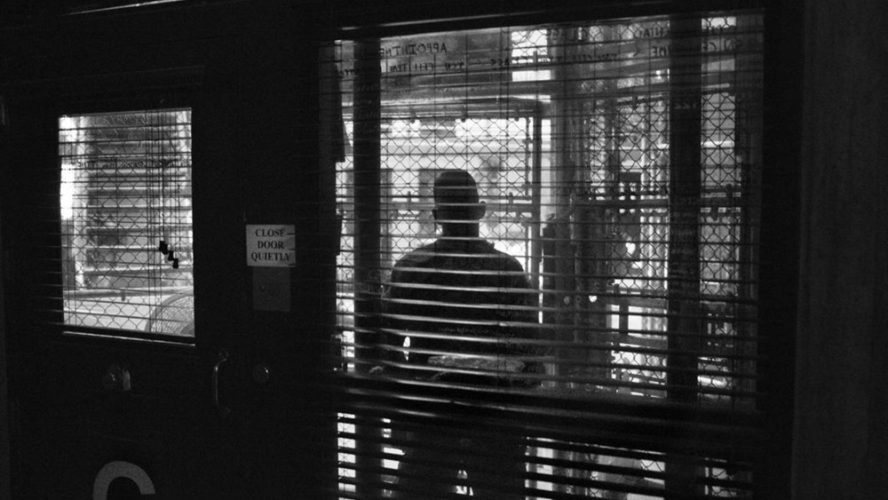 Views through the fenced-in guard post into the common area of a cell block in Camp 6 of the U.S. Naval Base and detention center in Guantanamo Bay, Cuba.