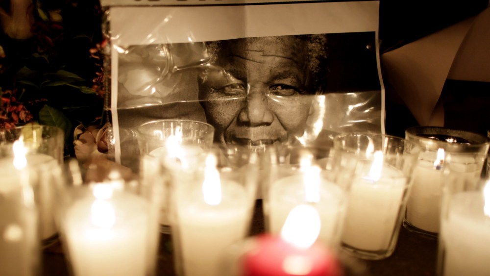Flowers are layed on the ground in front of the South African Embassy in Paris a day after the death of former South African President Nelson Mandela on Dec. 6, 2013