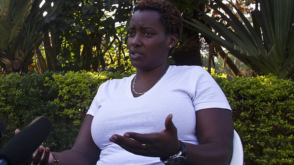 Gay rights activist Clair Byarugaba talks to journalists in Kampala on December 20, 2013.
