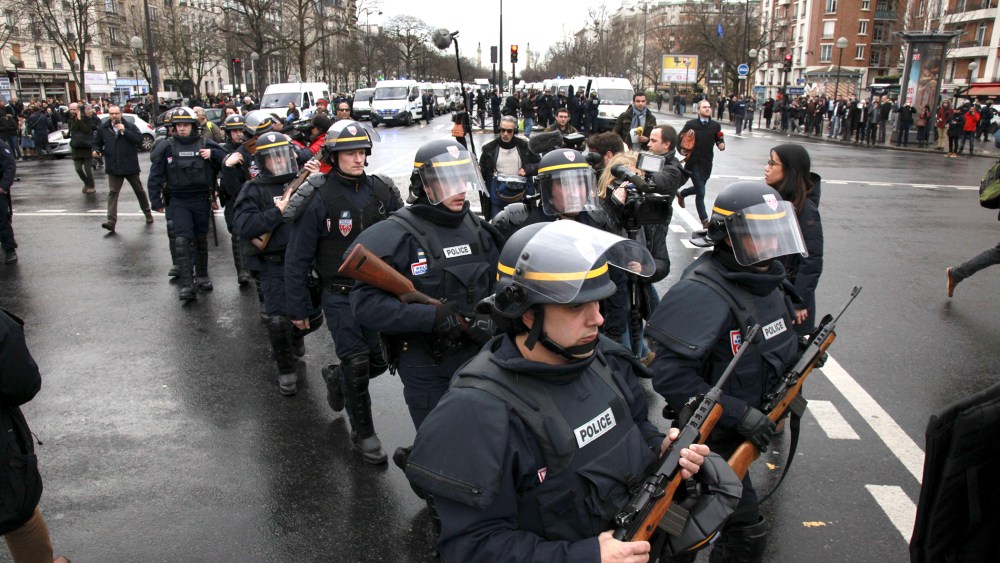 French police officers arrive to take up positions near Porte de Vincennes in Paris on Jan. 9, 2015.