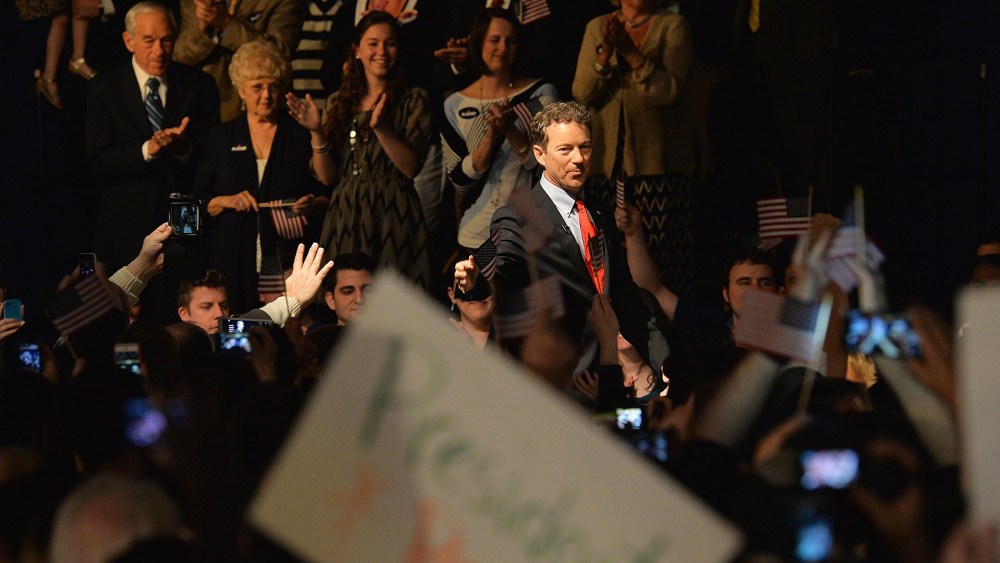 US Senator Rand Paul (R-KY) salutes the crowd before he speaks during the kickoff of the National Stand with Rand tour on April 7, 2015 in Louisville, Ky.