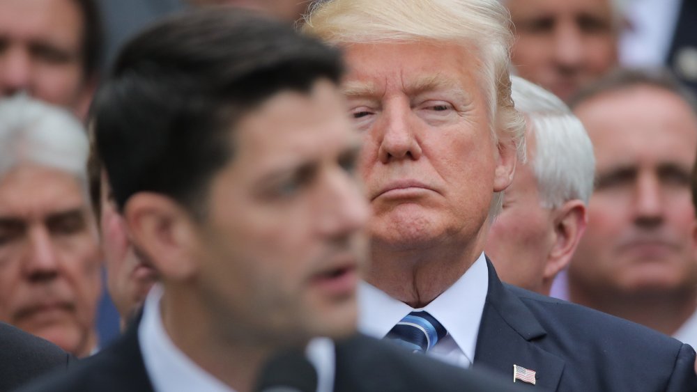 Image: U.S. President Trump listens to  Speaker Ryan as he gathers with Republican House members after healthcare bill vote at the White House in Washington