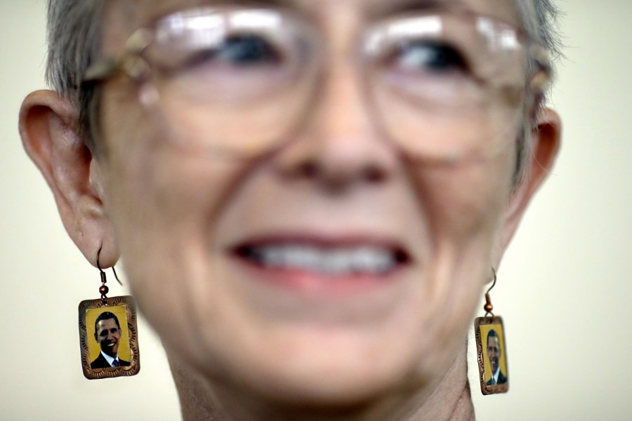 Delegate Vickie Vogel of La Grange, Texas, wears earrings decorated with the image of President Barack Obama in Charlotte, N.C.