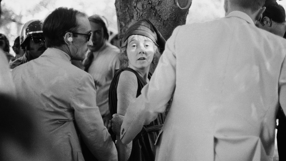 In this  Sept. 5, 1975 file photo, U.S. Secret Service agents put handcuffs on Lynette "Squeaky" Fromme after she pointed at President Gerald Ford, in Sacramento, Calif.