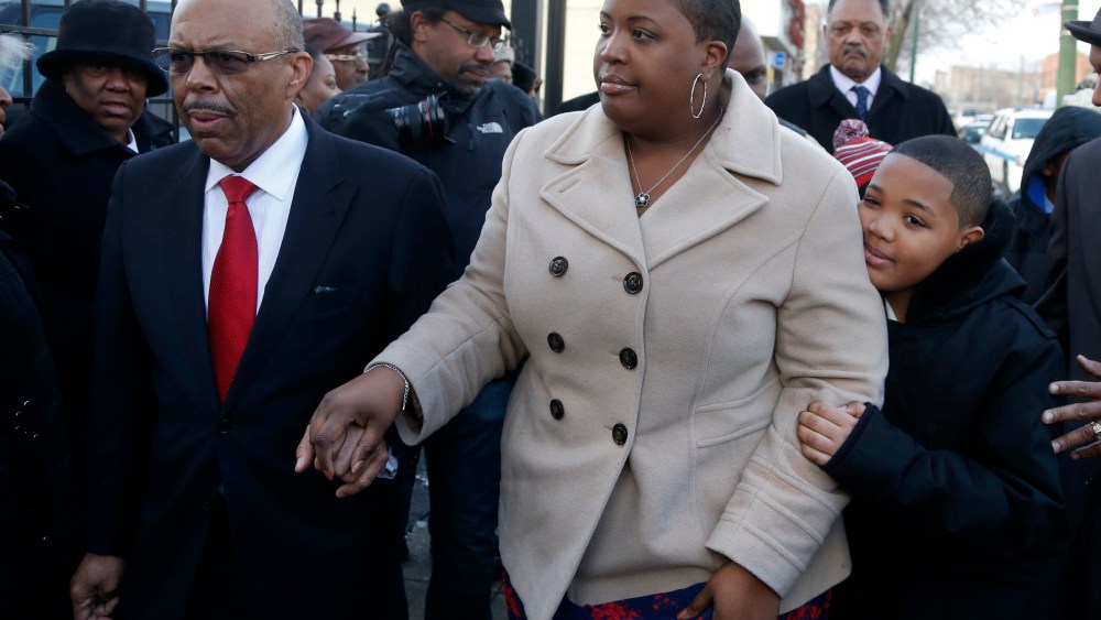 Funeral Director Edward Calahan left, escorts Cleopatra Pendleton and her son Nathaniel Jr. inside the funeral home for the wake of Mrs. Pendleton's daughter Hadiya Friday, Feb. 8, 2013, in Chicago. A White House official says Pendleton will attend the...