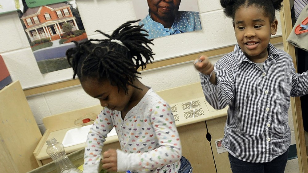 Gov. Bev Perdue, right, listens to Amaya Bryant and Jalynn Brandon, left,  Monday, Dec. 10, 2012, at Primary Colors Early Learning Center in Durham, N.C. Perdue visited the Pre-K classes to highlight the importance of preschool. (AP Photo/The Herald...