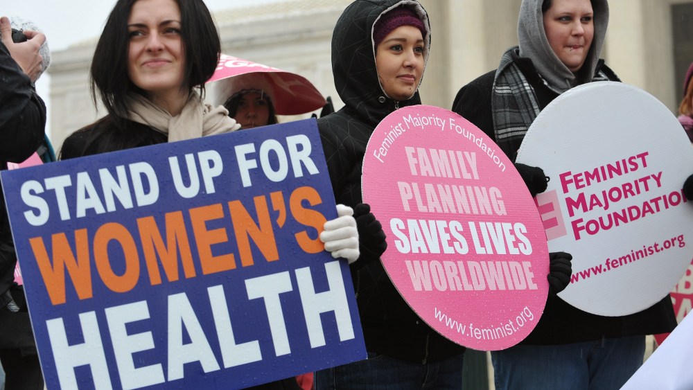File photo: Pro-choice activists hold placards during a rally outside of the Supreme Court on January 23, 2012 in Washington, DC.  (Photo: Mandel Ngan/AFP Photo)