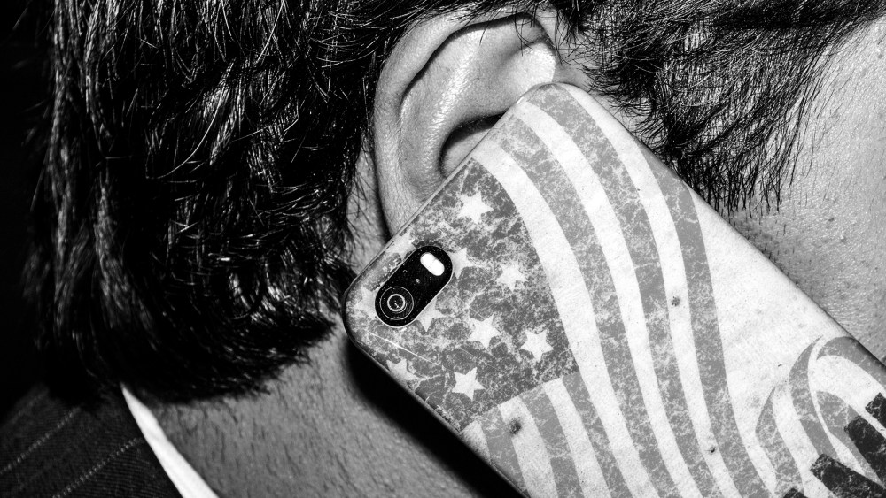 A guest uses his cell phone at The Conservative Political Action Conference, March 7, 2014, in National Harbor, Md.