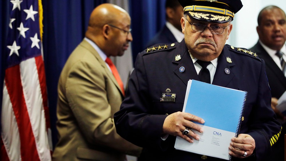 Philadelphia Police Commissioner Charles Ramsey holds a newly released report during a news conference on March 23, 2015, in Philadelphia. (Photo by Matt Rourke/AP)