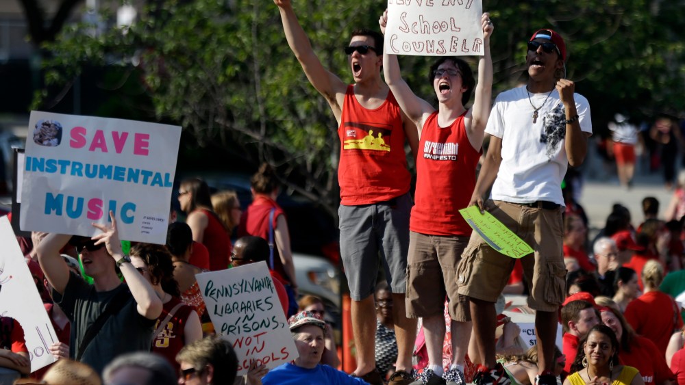 Protest outside the school district headquarters, Thursday, May 30, 2013, in Philadelphia. (AP Photo/Matt Rourke)