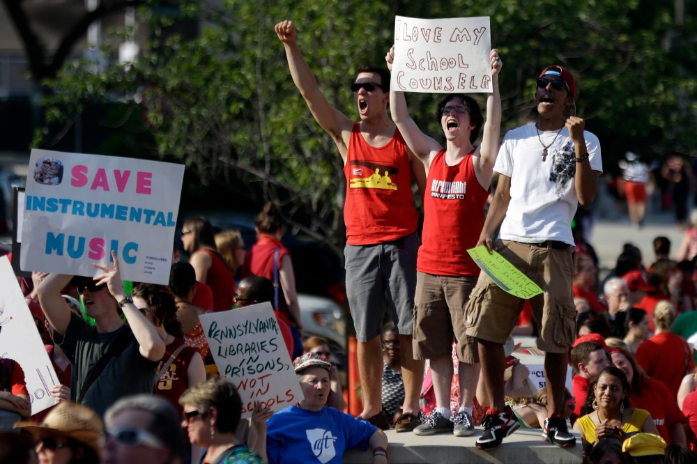 Protest outside the school district headquarters, Thursday, May 30, 2013, in Philadelphia. (AP Photo/Matt Rourke)
