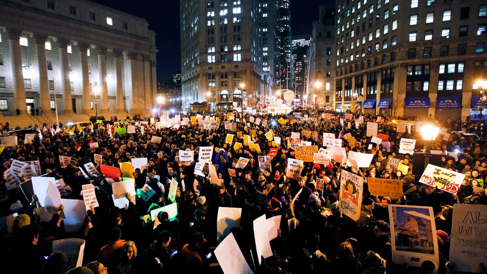 Protesters rally against a grand jury's decision not to indict the police officer involved in the death of Eric Garner in Foley Square, Dec. 4, 2014, in New York, N.Y. (Photo by Jason DeCrow/AP)