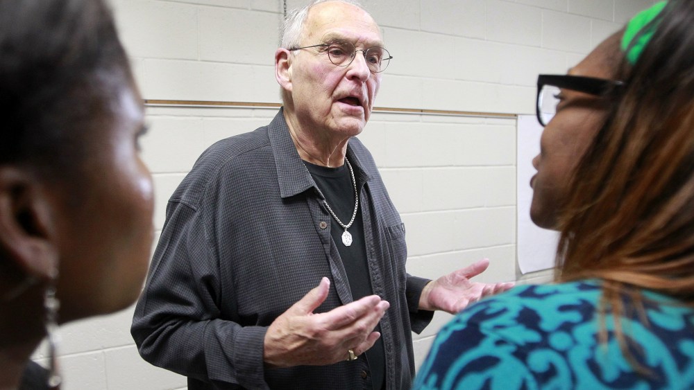 Wolfeboro Police Commissioner Robert Copeland is confronted by Whitney White, right, and Elizabeth Smith after a meeting on May 15, 2014 in Wolfeboro,  N.H.